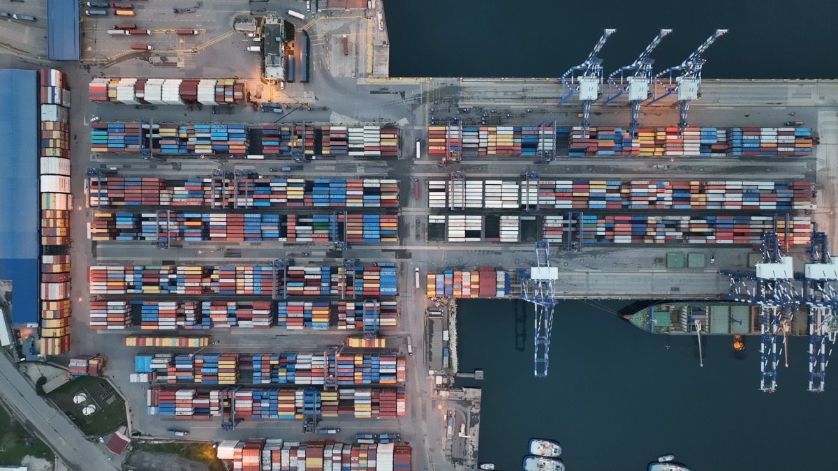 Aerial view of containers being loaded at a port