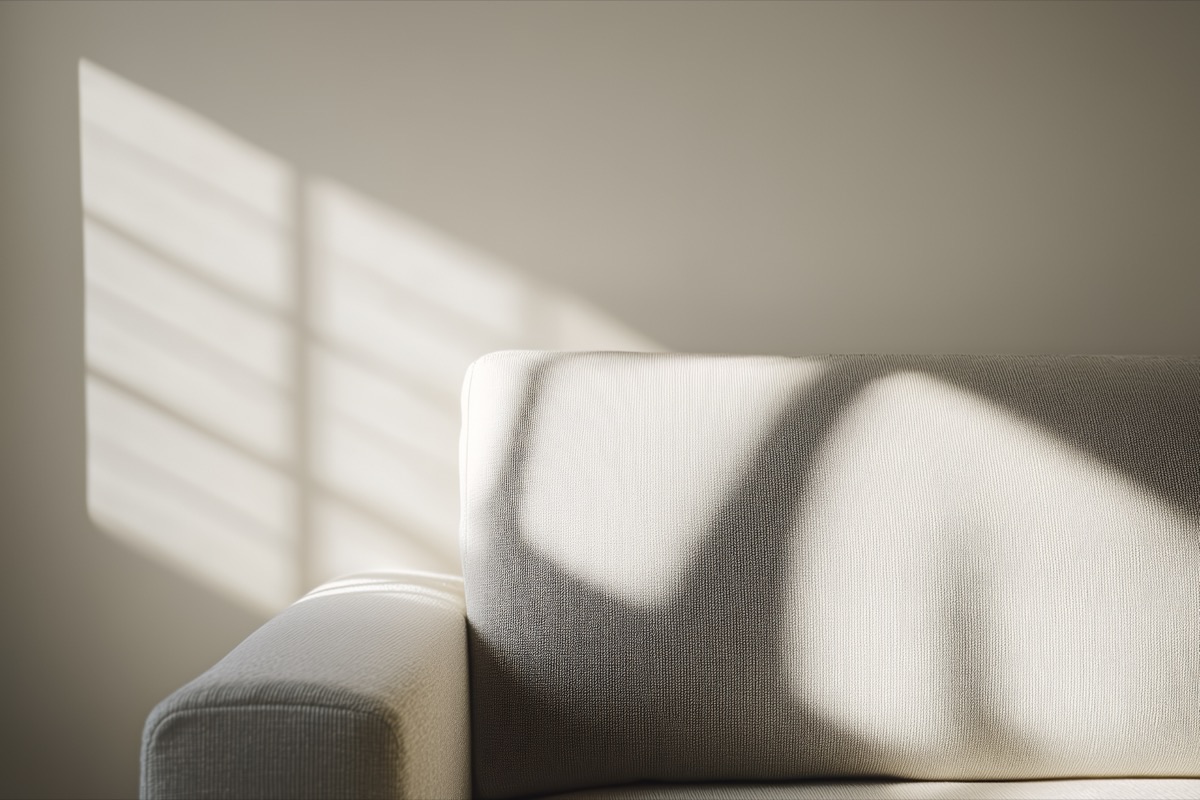 Sunlight and shadow across a minimal interior
