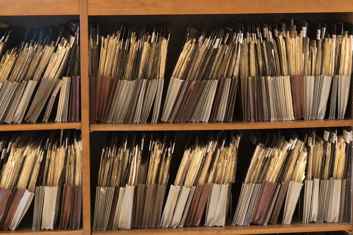 Archive shelves packed with document folders